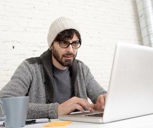 corporate portrait young hispanic hipster businessman working at office