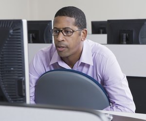 Serious African American Businessman Working on Computer