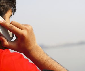 Close up shot of a man talking on cell phone