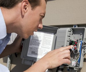 Man inspecting wiring box