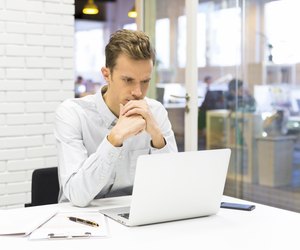 Man working on his laptop at the office in startup