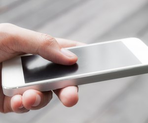 Close up of a woman using mobile smart phone