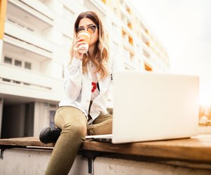 Young woman with a book and coffee.