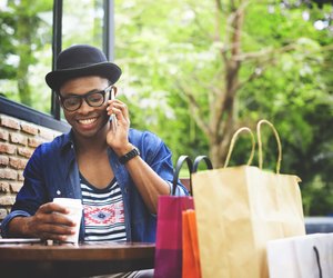 Man Shopping Outdoor Talking Mobile Phone Concept