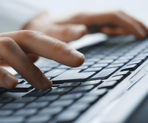 Image of man's hands typing. Selective focus
