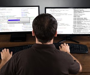 Man Programming Code On Computers