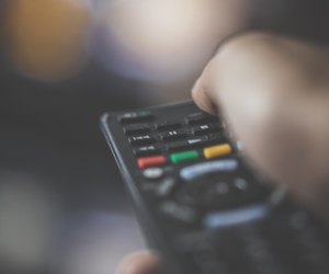 Person Changing the Channel
