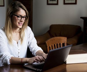 Young girl studying on the computer.