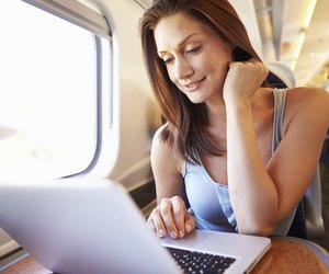 Woman Using Laptop On Train