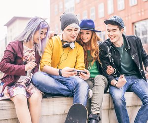 Teenagers meeting outdoors
