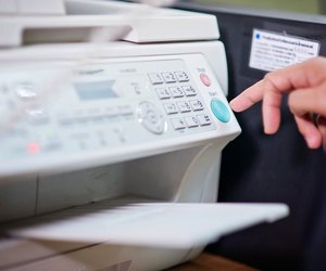 Businessman working with printer in the office ./Focus selection
