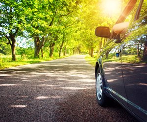 Car on asphalt road in summer