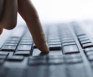 Close-up of typing male hands on keyboard