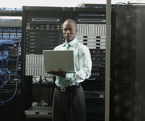 Businessman holding laptop computer
