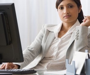 Indian businesswoman sitting at desk
