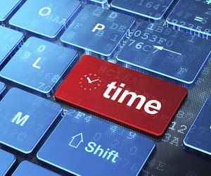 Timeline concept: Clock and Time on computer keyboard background