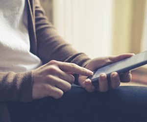 close up of hand woman typing on smart phone