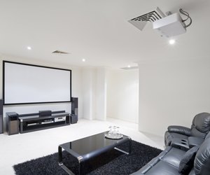 Home Theater Room with black leather recliner chairs