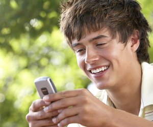 Teenage boy with cellular phone