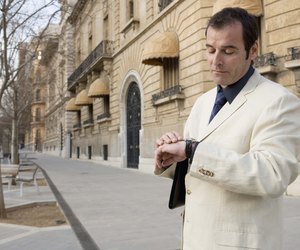 Businessman looking at watch