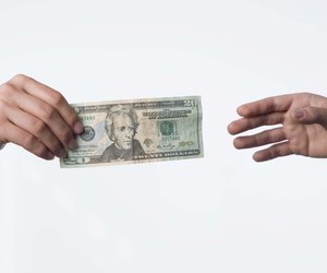 Hands exchanging money