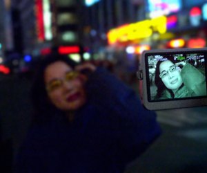 Video camera filming woman