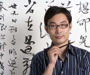 Chinese artist holding paintbrush