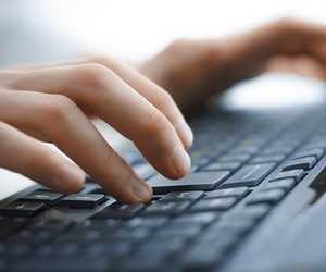 Close-up of typing female hands on keyboard