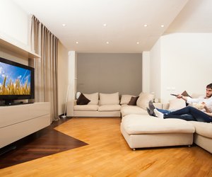 Couple eating popcorn while watching a movie
