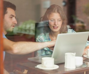 Two students looking at laptop