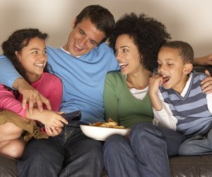 Family watching television together