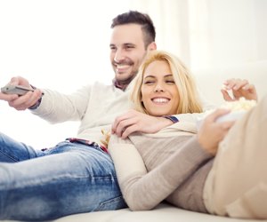 Couple at home watching TV