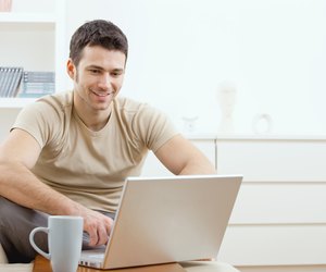 Happy man using computer