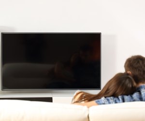 Couple watching tv screen view