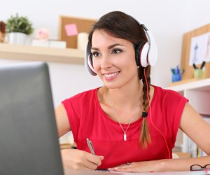 Beautiful smiling female student using online education service