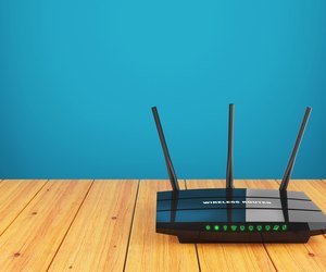 Wi-Fi wireless router on wooden table