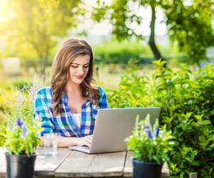 Beautiful young woman gardening