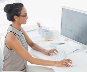 Designer working at her desk using computer