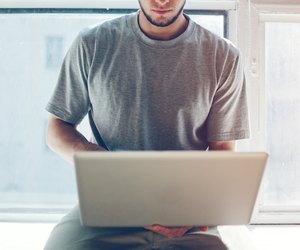 Young man working with laptop