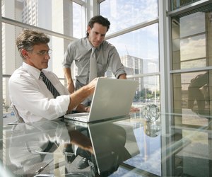 Businessmen using a laptop