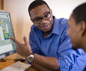 Men working at computer