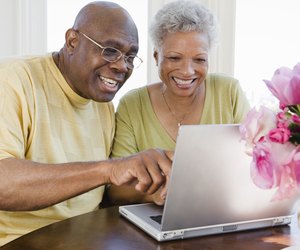 Couple using laptop computer