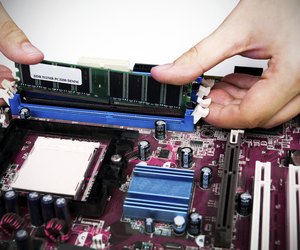 Man installing memory. PC motherboard RAM upgrade