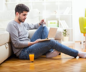 Casual paying online with credit card at home