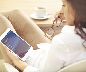 Businesswoman Examining Her Bank Investment on the Internet