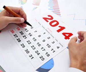 in the office with a 2014 calendar