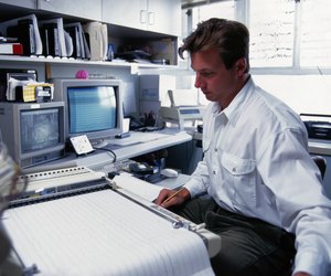 Man Looking at Printout