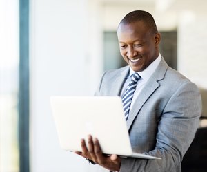 african business man using laptop