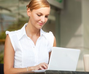 Businesswoman With Coffee & Laptop