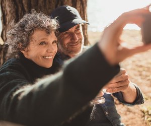 Senior couple at campsite taking selfie